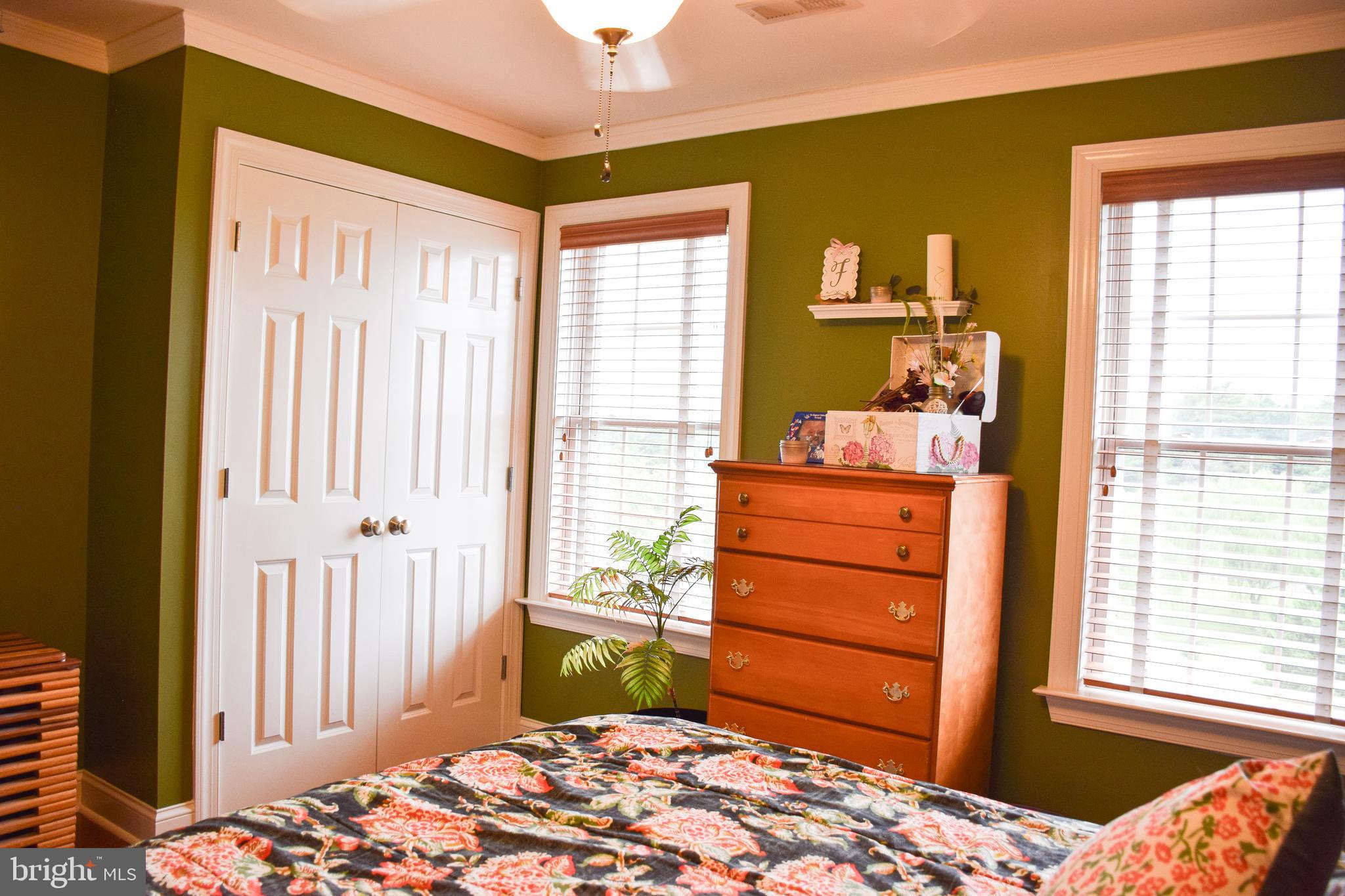 765 Gun Club Road Stephenson, VA 22656 - Photo 51 of 113 a bedroom with a bed and a window