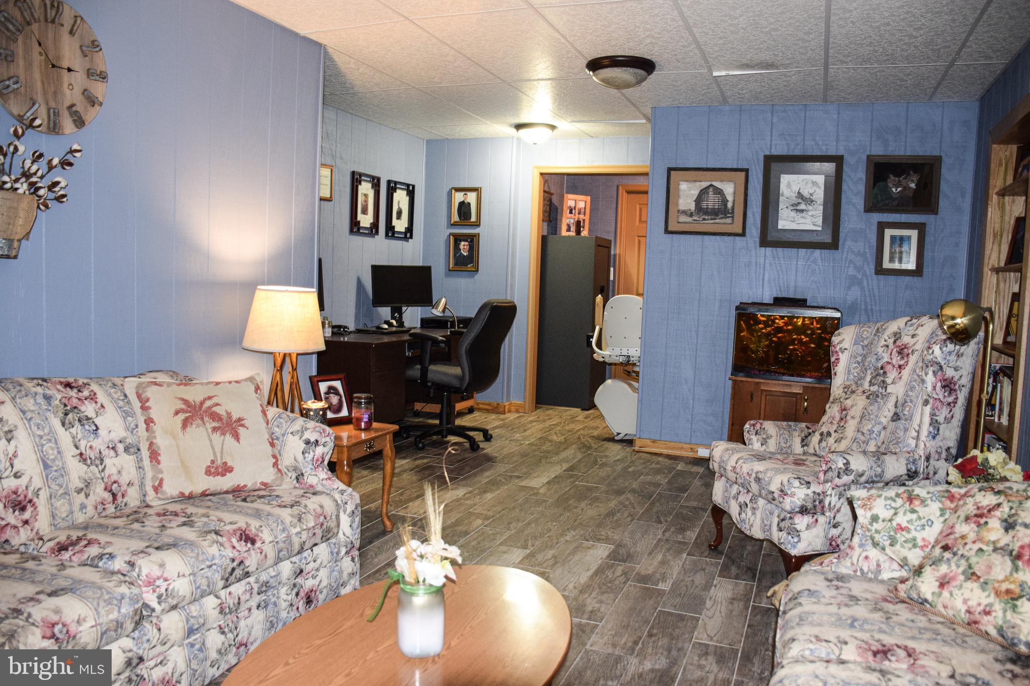 765 Gun Club Road Stephenson, VA 22656 - Photo 60 of 113 a living room with furniture and painting on the wall