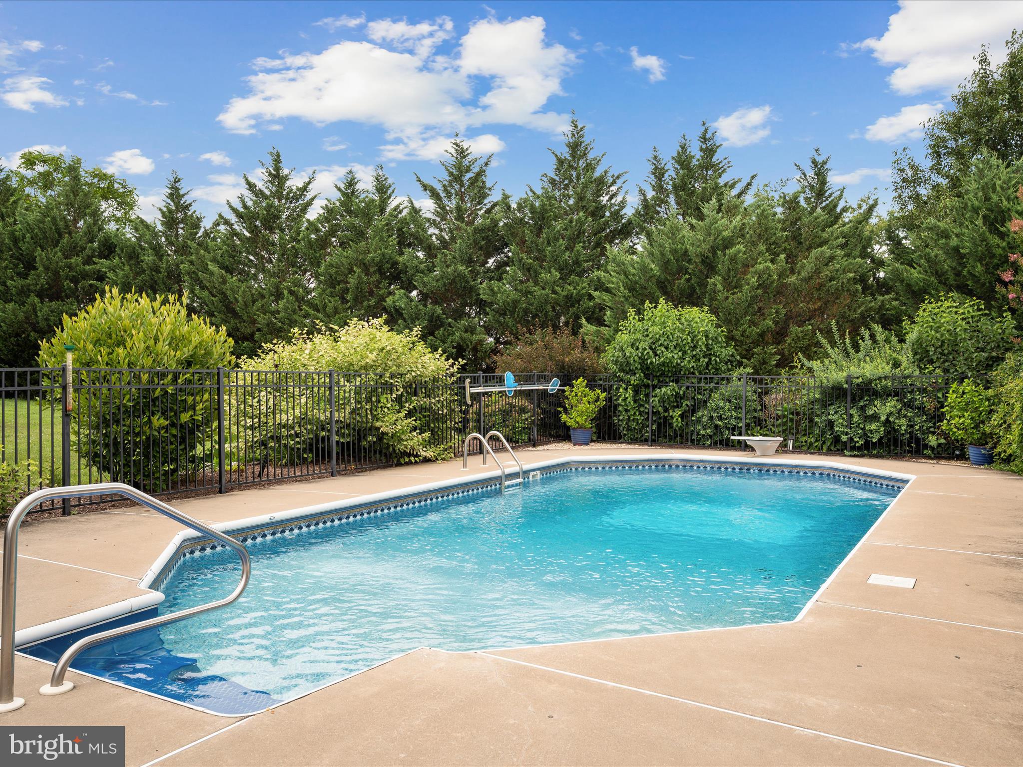 765 Gun Club Road Stephenson, VA 22656 - Photo 80 of 113 a view of a swimming pool with an outdoor space and seating area
