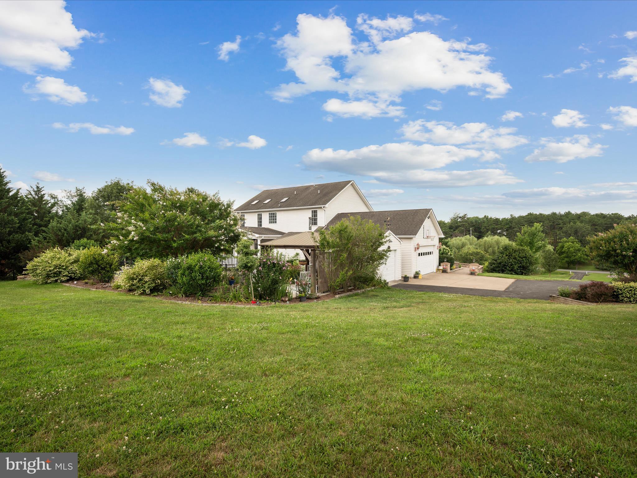 765 Gun Club Road Stephenson, VA 22656 - Photo 86 of 113 a front view of a house with a big yard