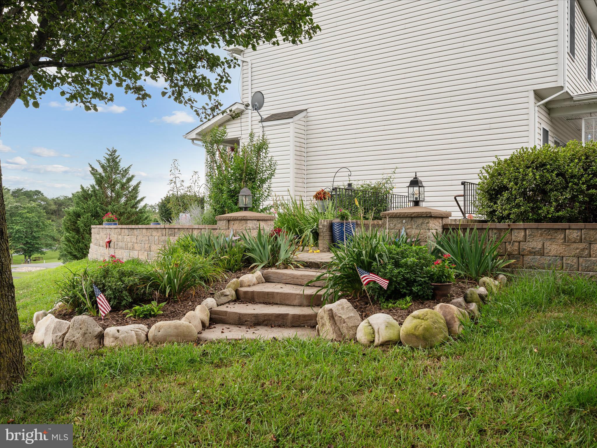 765 Gun Club Road Stephenson, VA 22656 - Photo 90 of 113 a front view of a house with a yard and outdoor seating