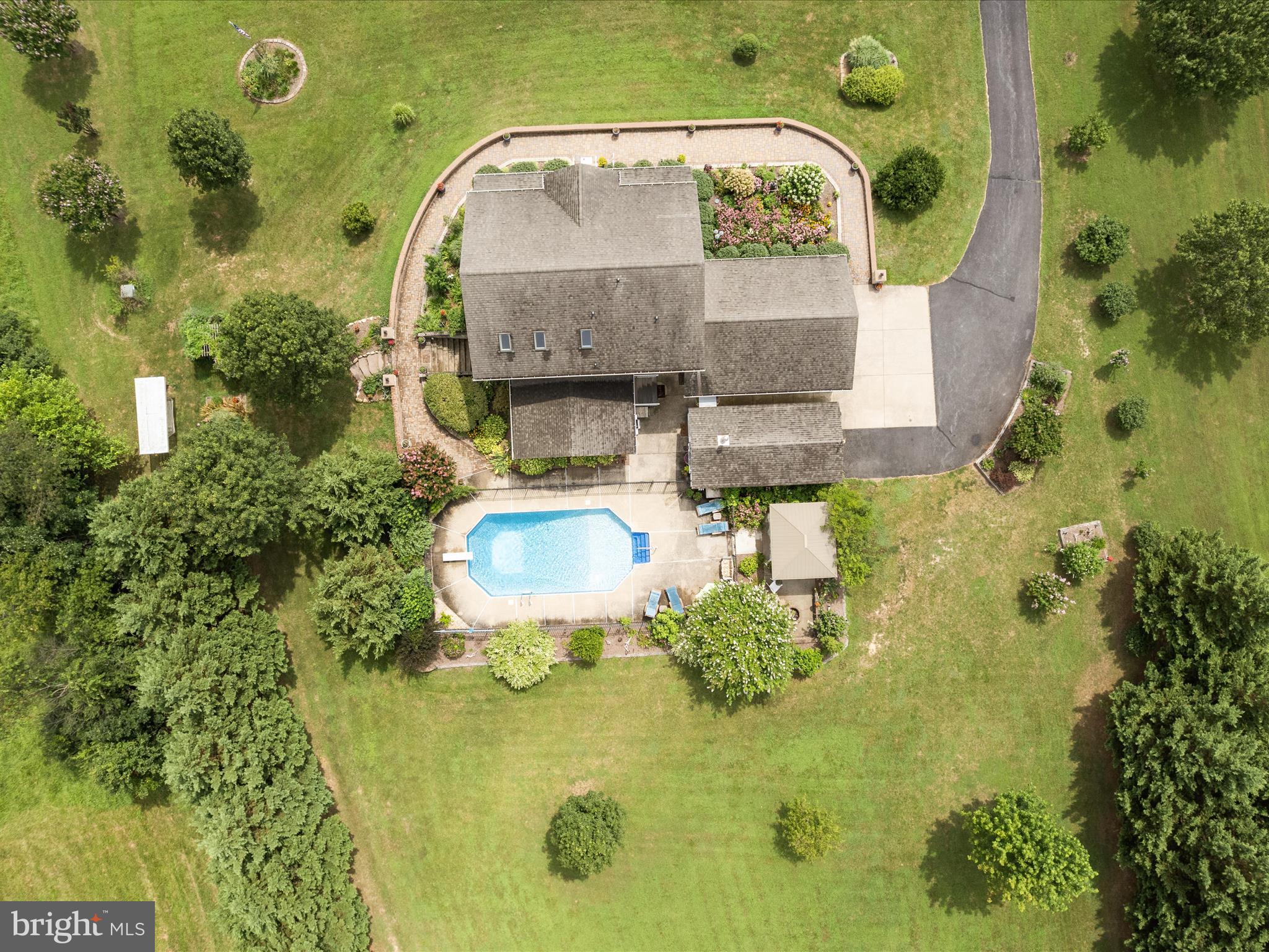 765 Gun Club Road Stephenson, VA 22656 - Photo 97 of 113 an aerial view of a swimming pool with outdoor seating