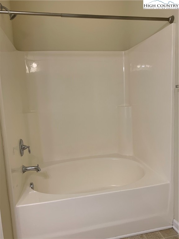 190 Eli Hartley Drive, Unit 210 Boone, NC 28607 - Photo 13 of 19 a bathroom with a shower and a bathtub