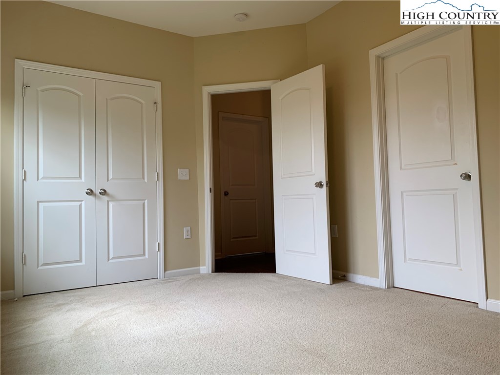190 Eli Hartley Drive, Unit 210 Boone, NC 28607 - Photo 15 of 19 an empty room with closet and a bathroom