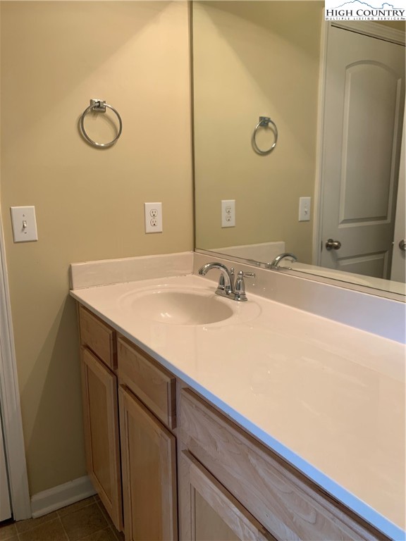 190 Eli Hartley Drive, Unit 210 Boone, NC 28607 - Photo 16 of 19 a bathroom with a sink and a mirror