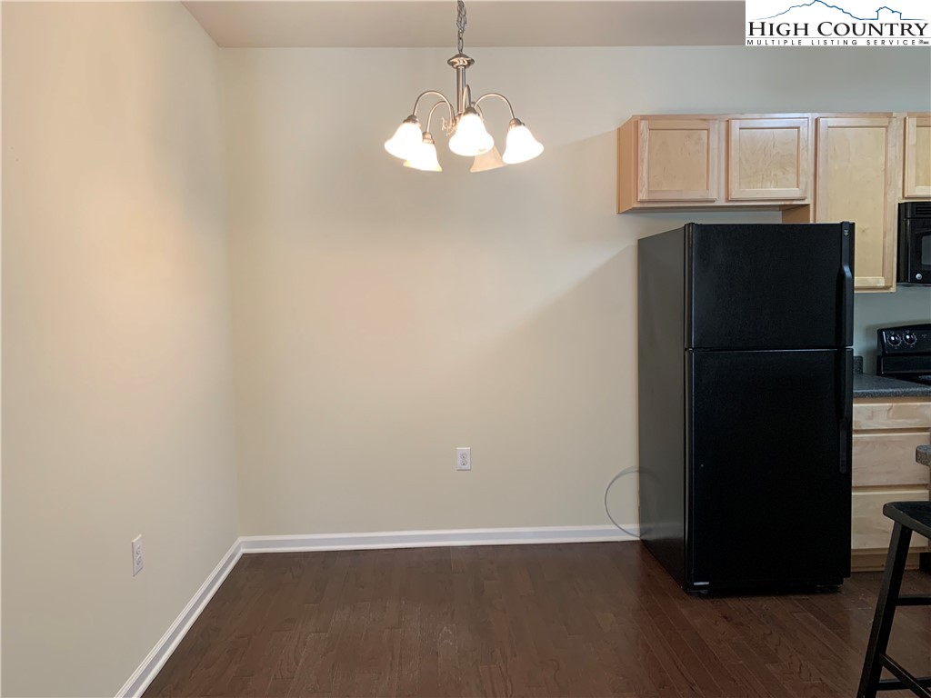 190 Eli Hartley Drive, Unit 210 Boone, NC 28607 - Photo 18 of 19 a view of a kitchen with wooden cabinet