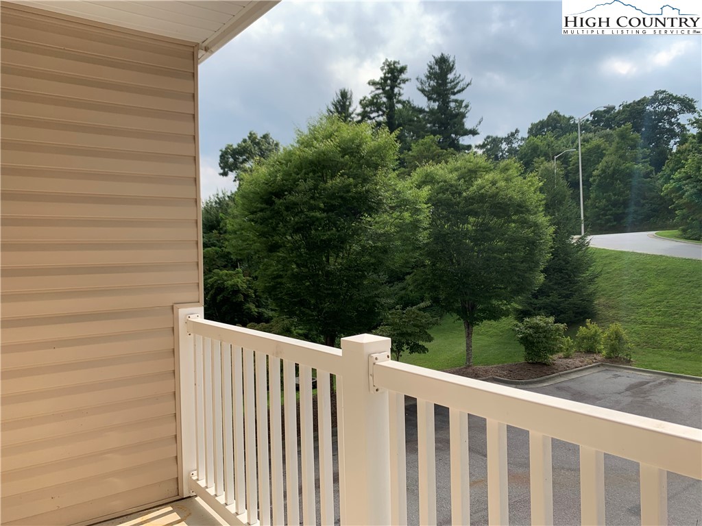 190 Eli Hartley Drive, Unit 210 Boone, NC 28607 - Photo 19 of 19 a wooden fence with trees in the background