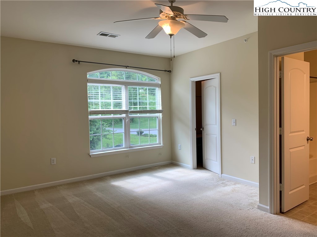 190 Eli Hartley Drive, Unit 210 Boone, NC 28607 - Photo 10 of 19 a view of an empty room with a window