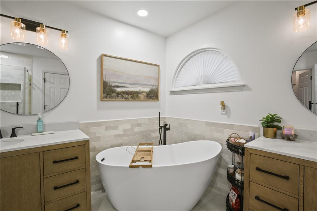 920 Bridge Pointe Court Alpharetta, GA 30005 - Photo 15 of 18 a bathroom with a sink and a mirror
