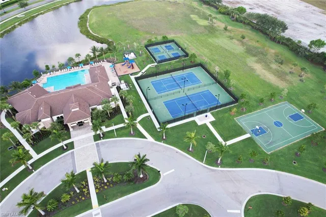 an aerial view of a house with garden space and street view