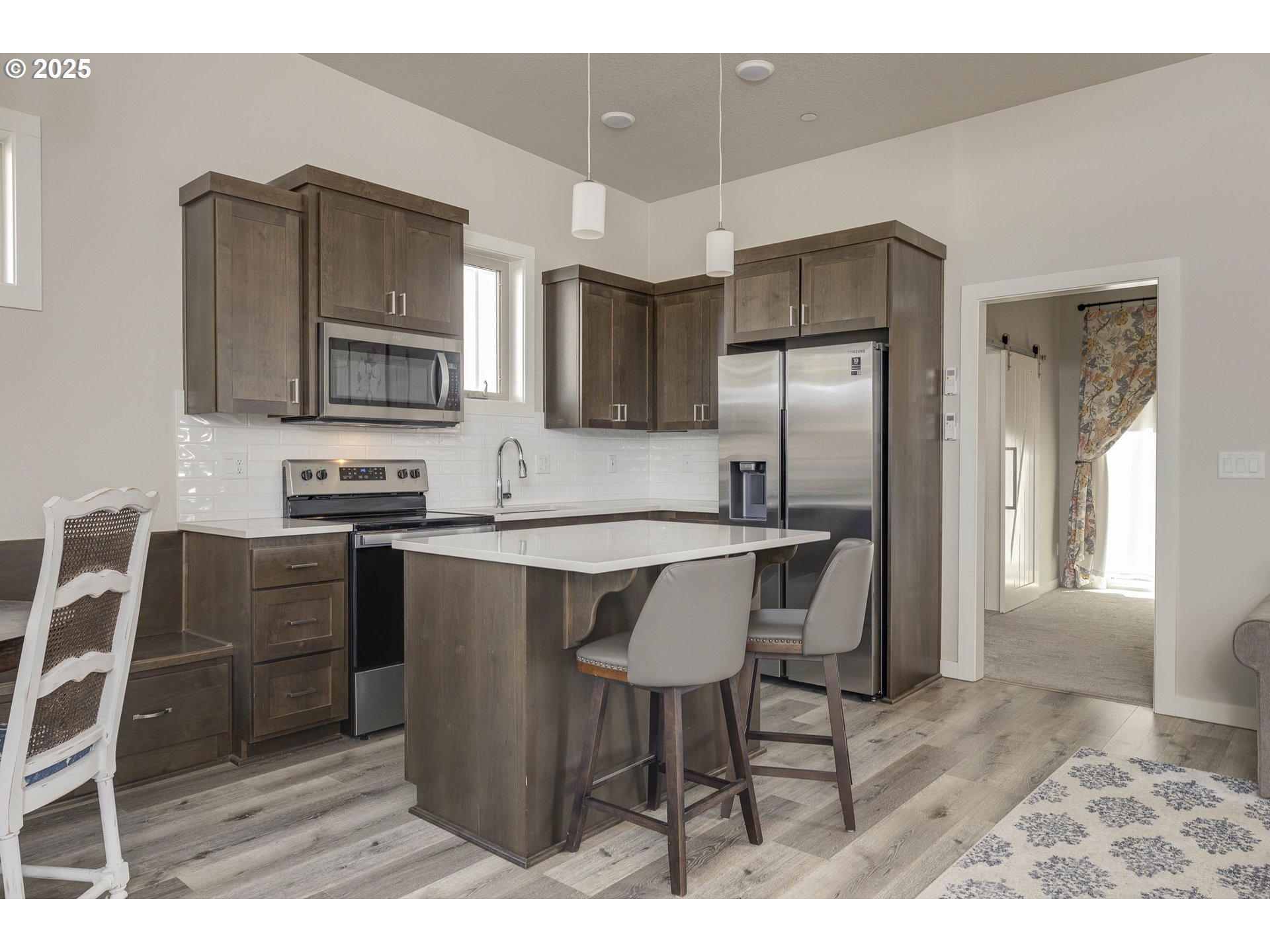 1821 Cousteau Loop Southeast Salem, OR 97302 - Photo 11 of 27 a kitchen with stainless steel appliances granite countertop a refrigerator stove microwave and sink