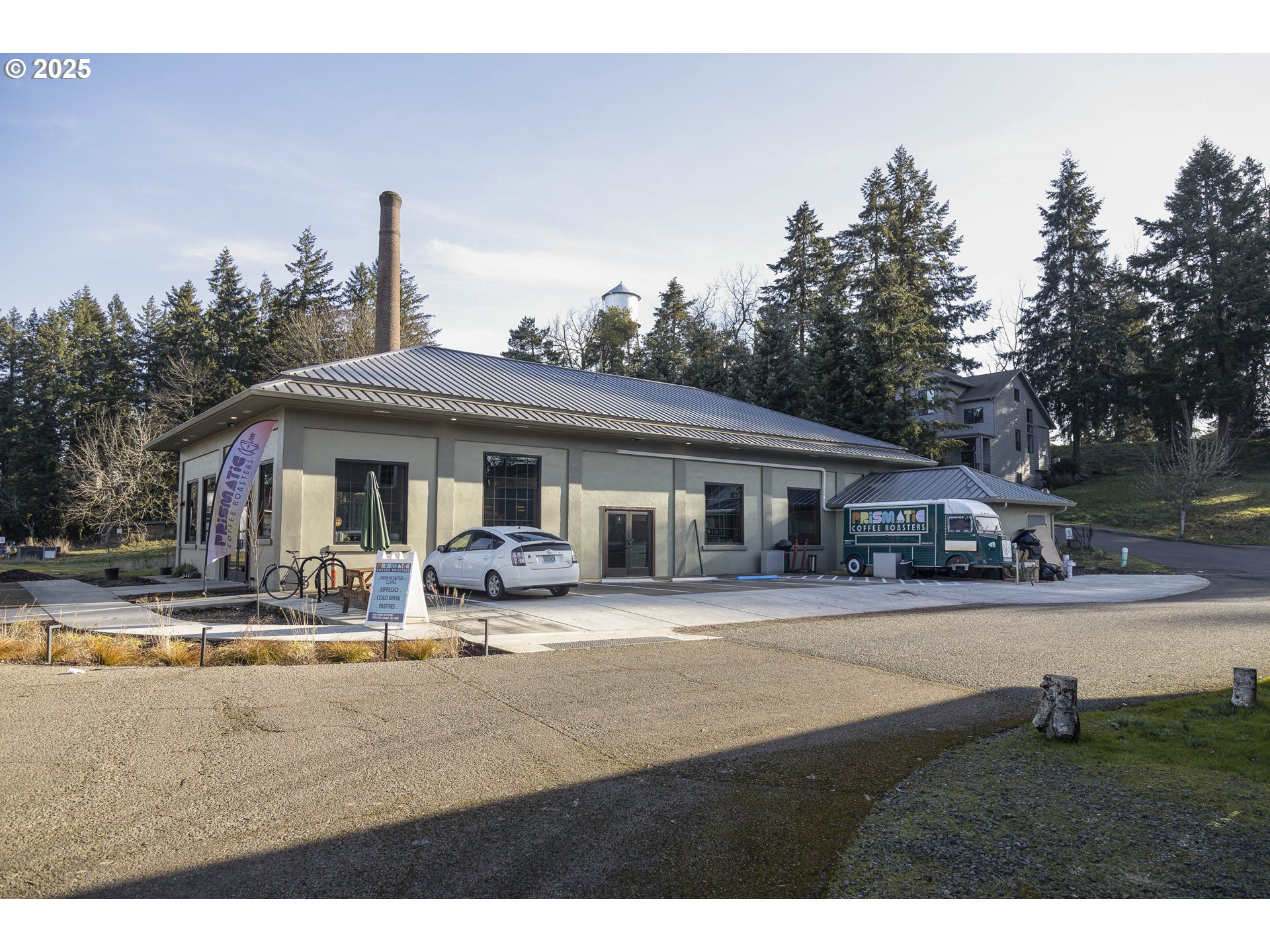 1821 Cousteau Loop Southeast Salem, OR 97302 - Photo 27 of 27 a front view of a house with garden and trees