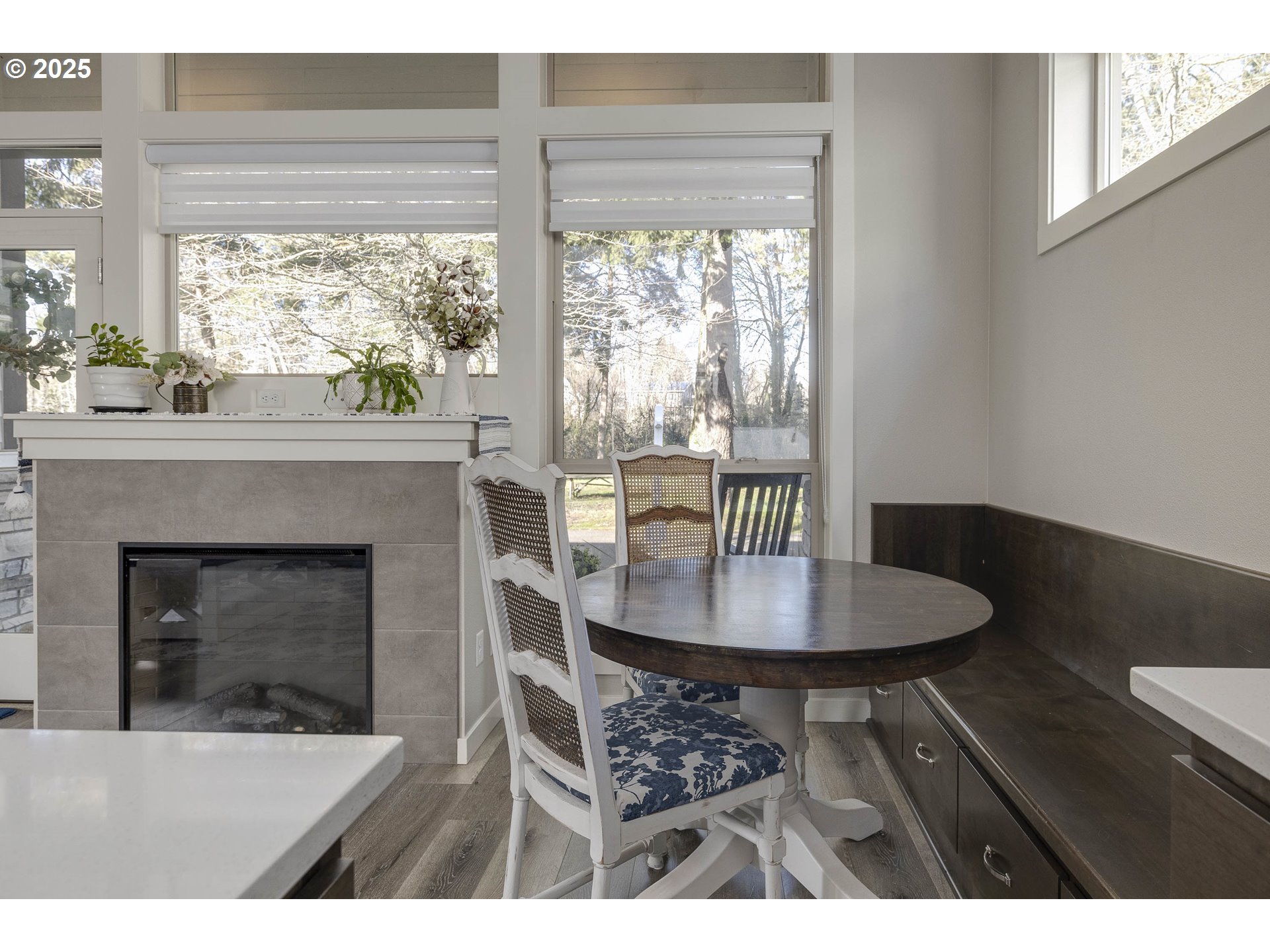 1821 Cousteau Loop Southeast Salem, OR 97302 - Photo 8 of 27 a dining room with furniture and a fireplace