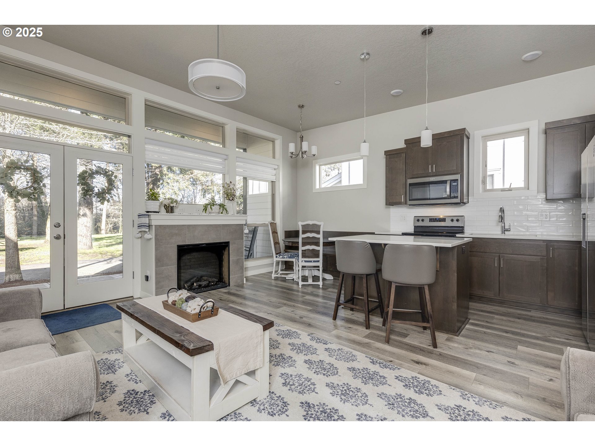 1821 Cousteau Loop Southeast Salem, OR 97302 - Photo 10 of 27 a living room with furniture a fireplace and a flat screen tv