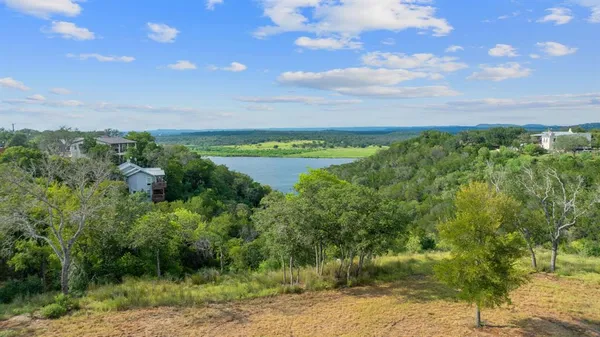 a view of a lake with a yard
