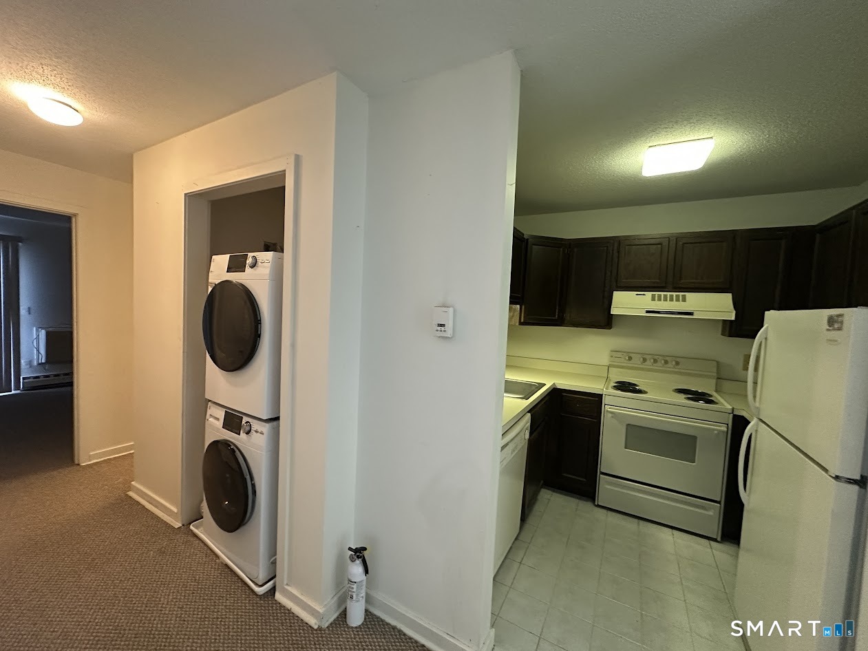 295 Redstone Hill Road, Unit 3 Bristol, CT 06010 - Photo 2 of 13 a utility room with dryer and washer