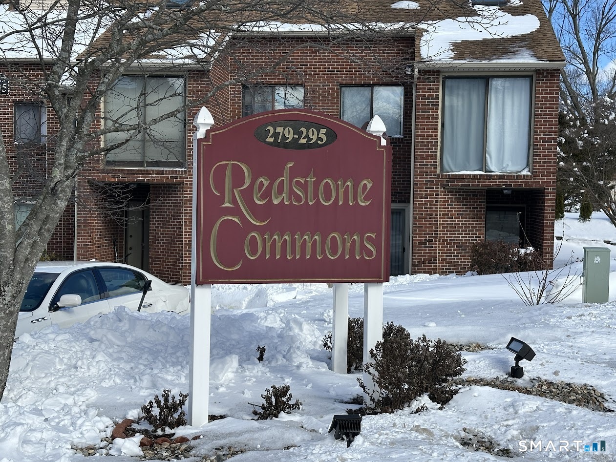 295 Redstone Hill Road, Unit 3 Bristol, CT 06010 - Photo 7 of 13 a front view of a building with sign board