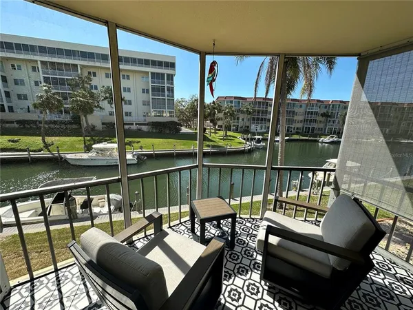 a view of balcony with furniture