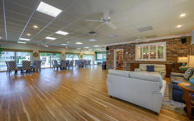 a view of a livingroom with furniture and a bookshelf