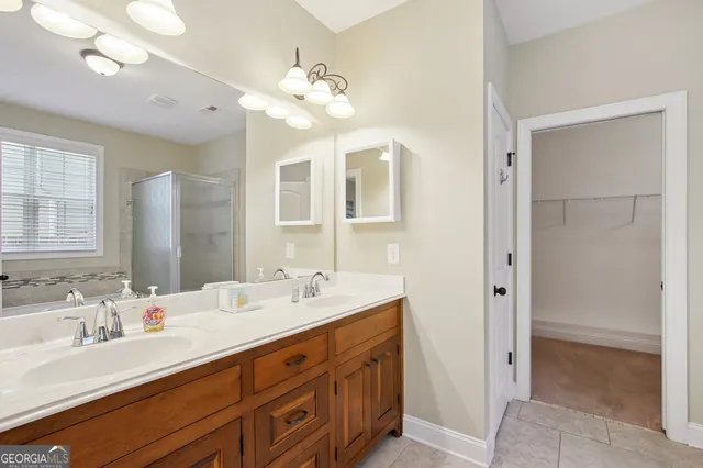 a bathroom with a tub a sink and a mirror