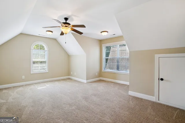 a view of a patio with a table chairs and backyard