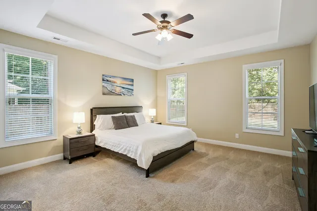 a bathroom with a tub and a window