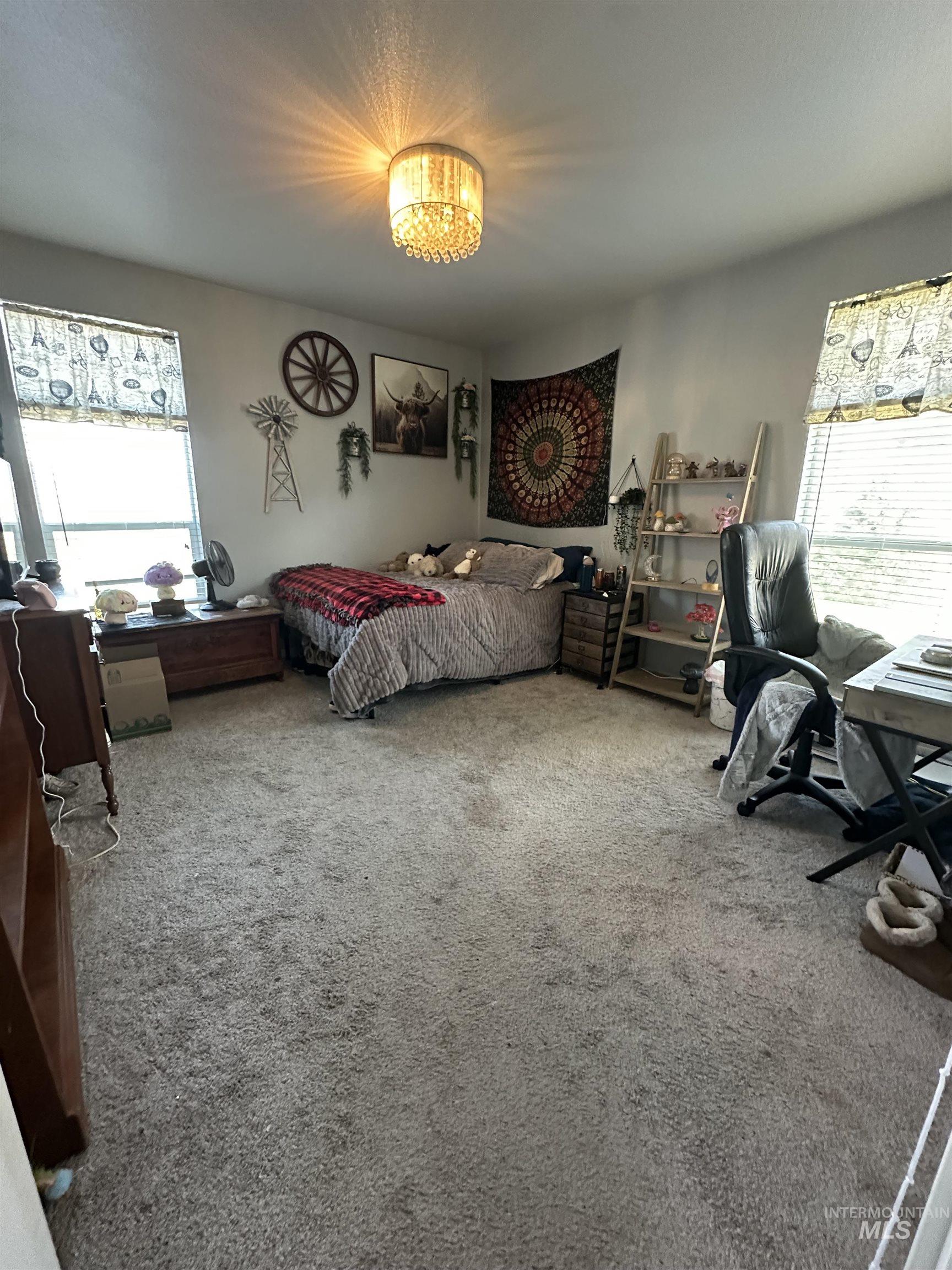 2859 Luke's Gulch Road Stites, ID 83552 - Photo 21 of 48 Bedroom featuring multiple windows and light colored carpet