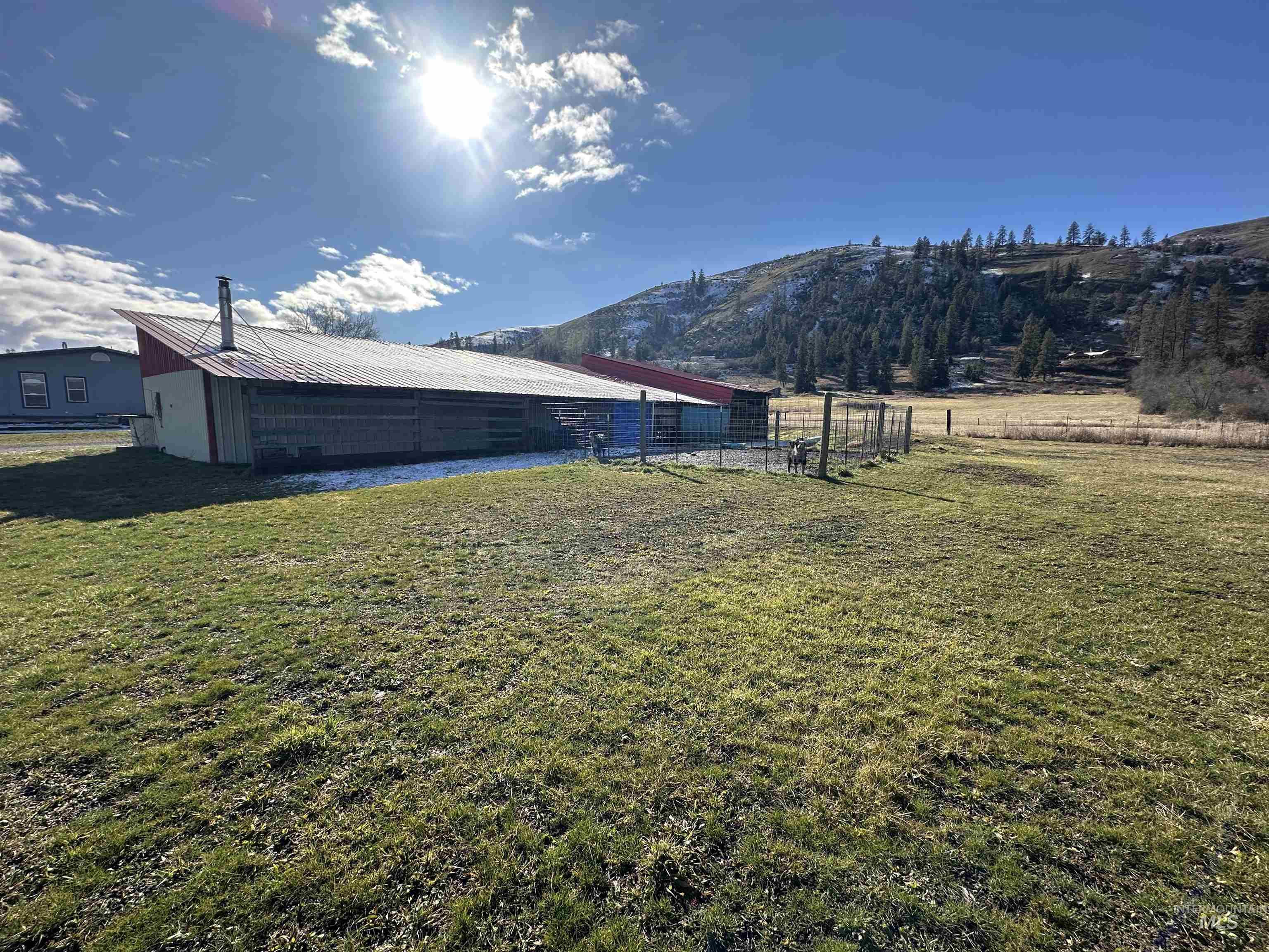 2859 Luke's Gulch Road Stites, ID 83552 - Photo 33 of 48 View of yard featuring a pole building, an outbuilding, a mountain view, and a view of countryside