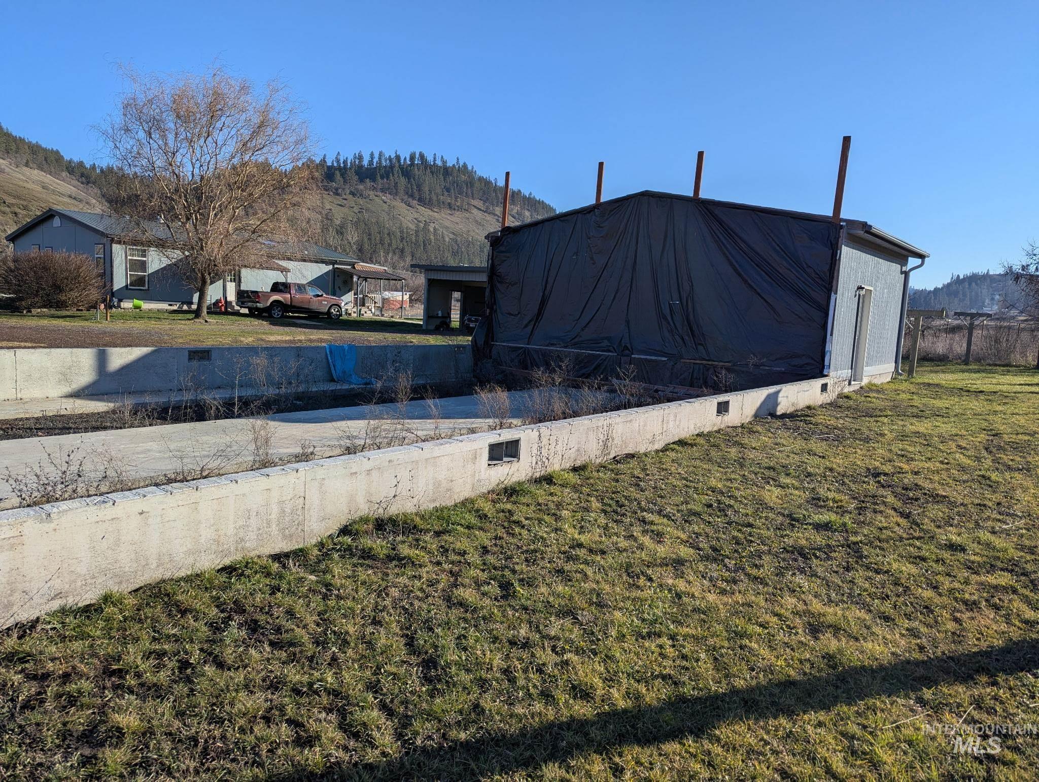 2859 Luke's Gulch Road Stites, ID 83552 - Photo 40 of 48 View of grassy yard featuring a mountain view
