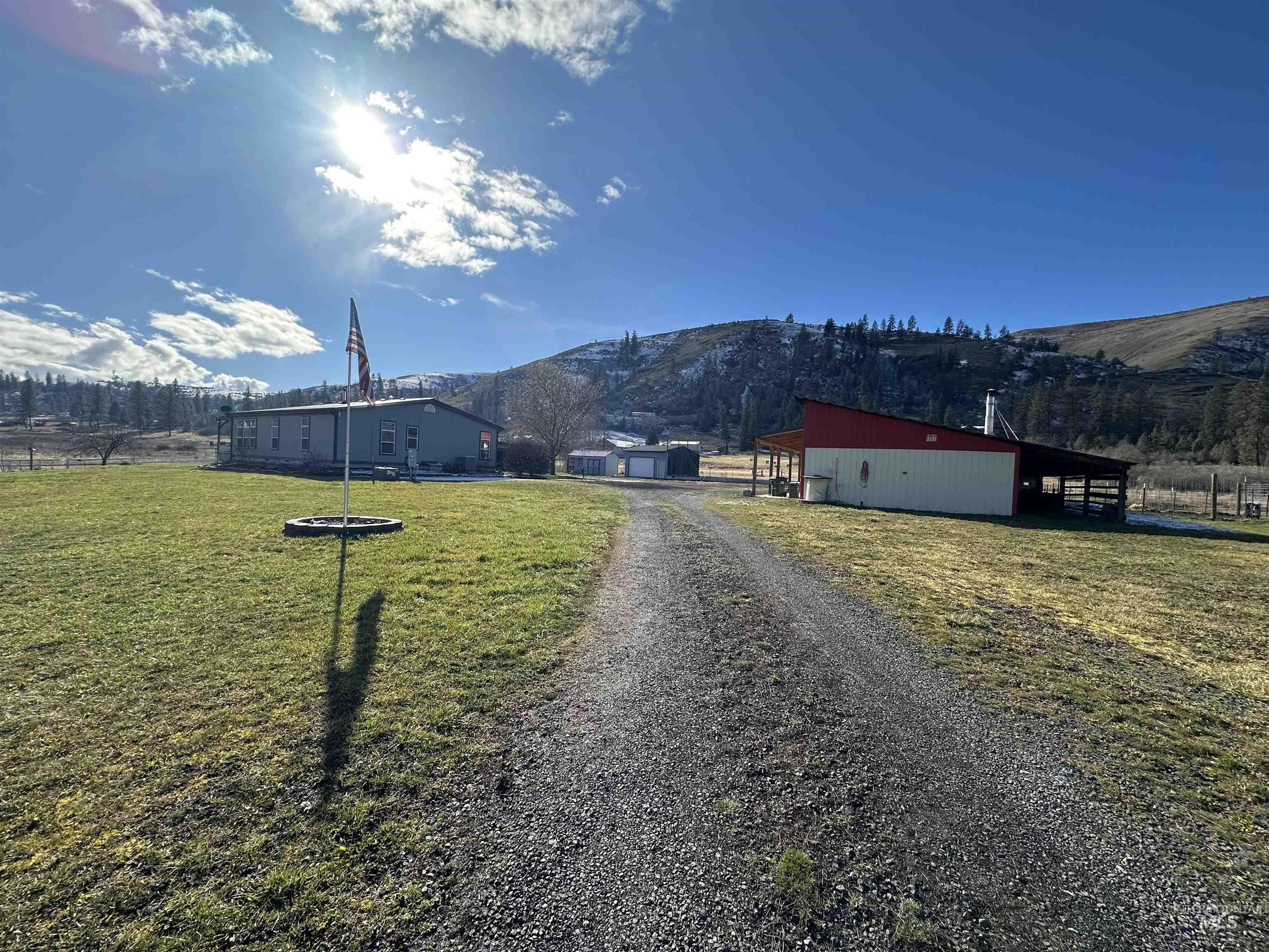 2859 Luke's Gulch Road Stites, ID 83552 - Photo 47 of 48 View of dirt / gravel road with a pole building, a mountain view, and a rural view