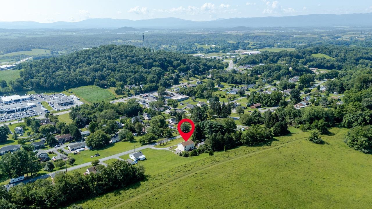 107 Orchard Road Staunton, VA 24401 - Photo 43 of 44 an aerial view of green landscape with trees houses and mountain view
