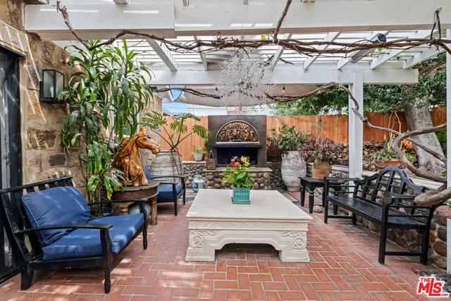 a view of a chairs and table in a patio
