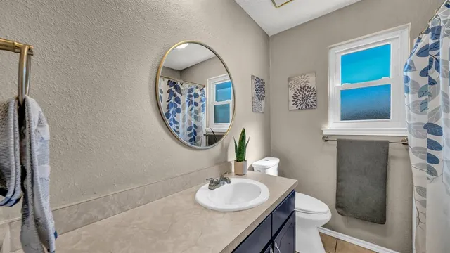 a bedroom with furniture and a window