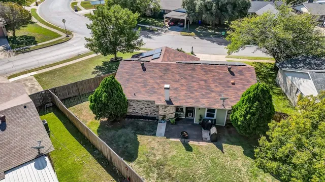 an aerial view of a house with a garden and plants
