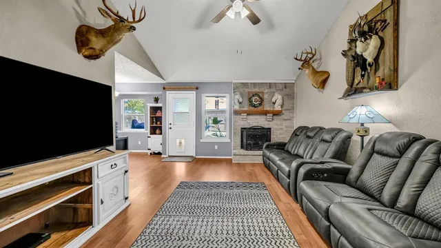 a living room with furniture and a flat screen tv