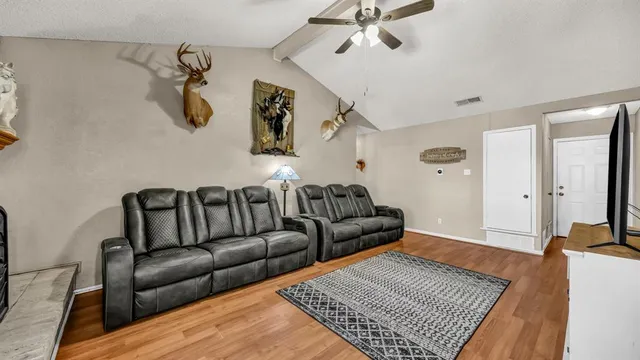a living room with furniture and a rug
