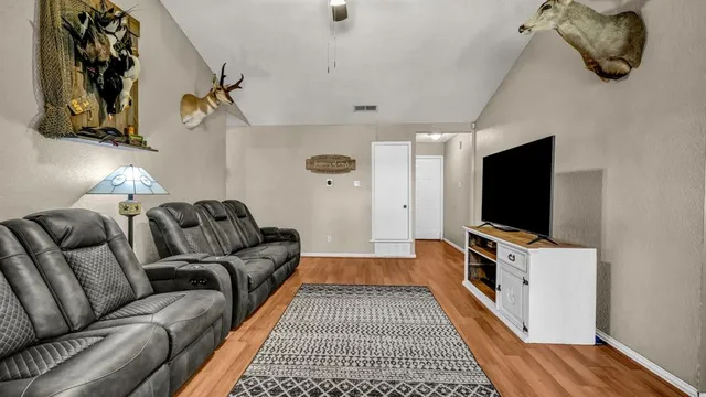 a living room with a couch and a flat screen tv