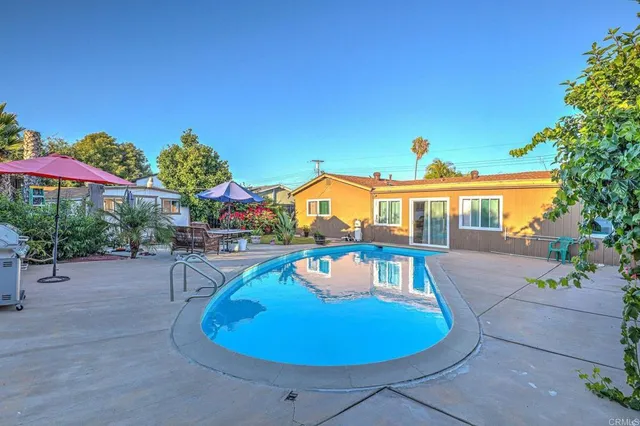 a view of a swimming pool with a patio