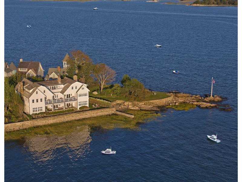 a view of water heater room with wooden floor