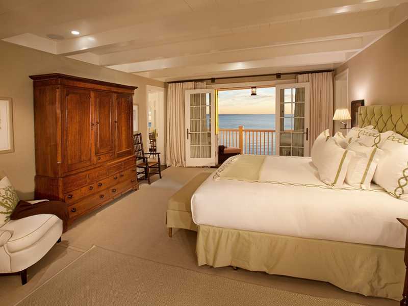 18 Rocky Point Road Rowayton, CT 06853 - Photo 12 of 24 a bedroom with a bed and wooden floor