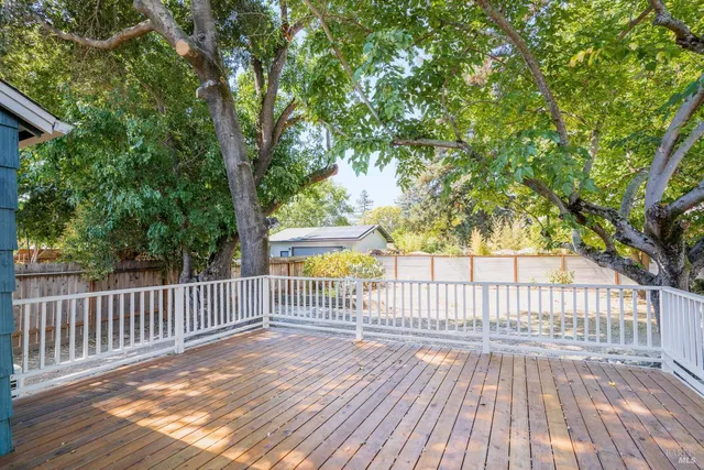 a view of deck with wooden floor and fence