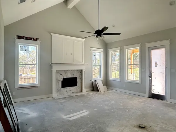 a living room with furniture and a fireplace