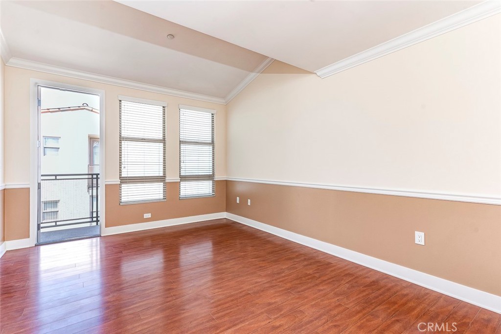 596 South Brea Boulevard Brea, CA 92821 - Photo 23 of 33 a view of empty room with wooden floor and fan