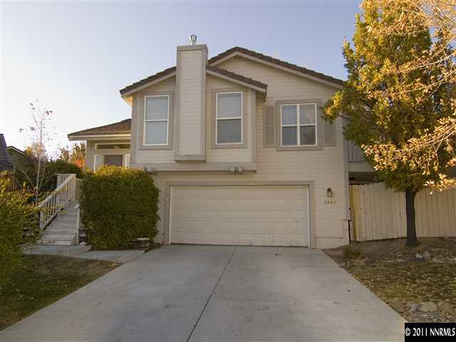 2225 Ridgeview Drive Reno, NV 89519 - Photo 1 of 12 a front view of a house with a yard