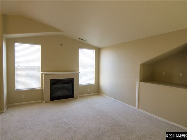 2225 Ridgeview Drive Reno, NV 89519 - Photo 3 of 12 a view of empty room with a fireplace