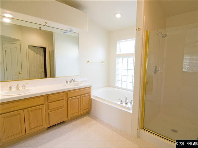 2225 Ridgeview Drive Reno, NV 89519 - Photo 7 of 12 a spacious bathroom with a tub sink shower and mirror