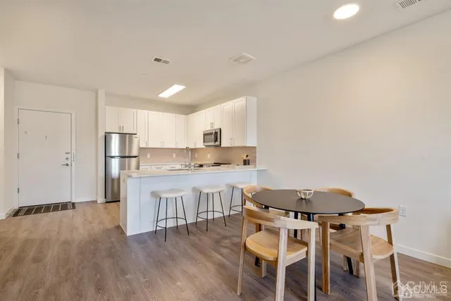 a kitchen with a table and chairs in it