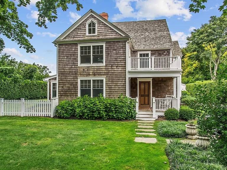 56 Butter Lane Bridgehampton, NY 11932 - Photo 1 of 18 a front view of a house with a yard