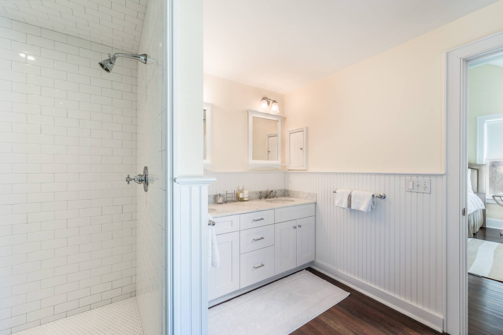 56 Butter Lane Bridgehampton, NY 11932 - Photo 14 of 18 a bathroom with a granite countertop sink a toilet and shower