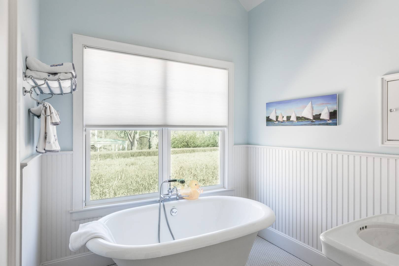 56 Butter Lane Bridgehampton, NY 11932 - Photo 16 of 18 a white bath tub sitting next to a window